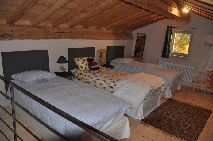 Loft with three single beds
