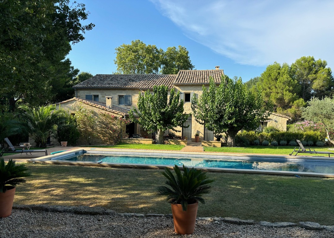 The house seen across the pool and garden
