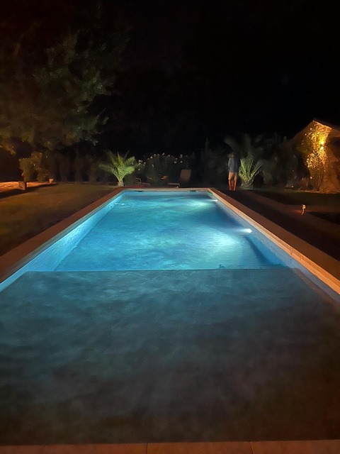 The pool lit at night